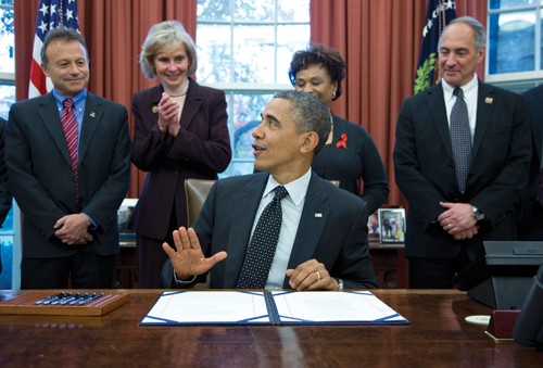 President Obama signing the HOPE Act into law